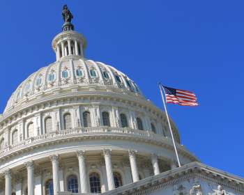 The White House with an American flag on a flagpole