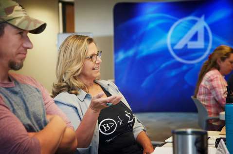 Teachers interact with Aerospace employees at a workshop in Albuquerque