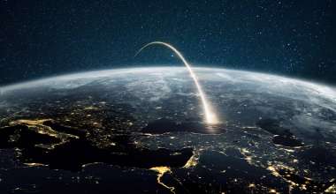 an artist's visualization of a rocket plume arcing over the earth into the stars beyond.