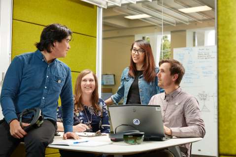 aerospace employees working together in a room