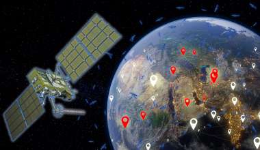 Satellite orbiting Earth with smaller satellites in the backdrop.