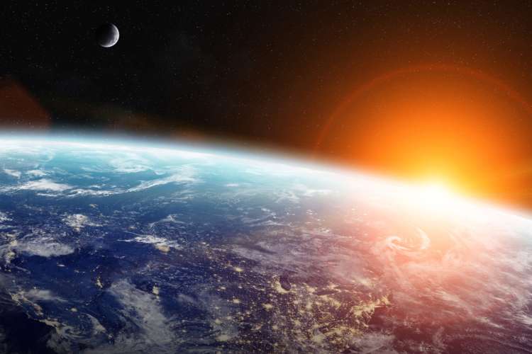 Image from space showing the earth and moon