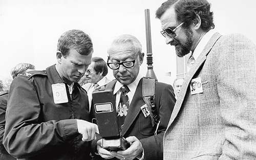 Vice president of Aerospace's Navstar program group wears Navstar backpack. 