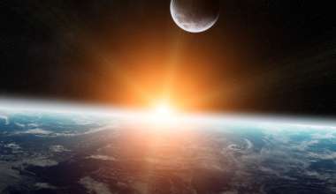 Sun rising on a zoomed out shot of Earth