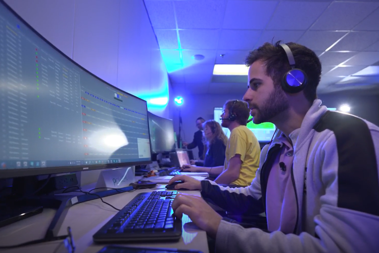 Man using a computer to participate in wargame.